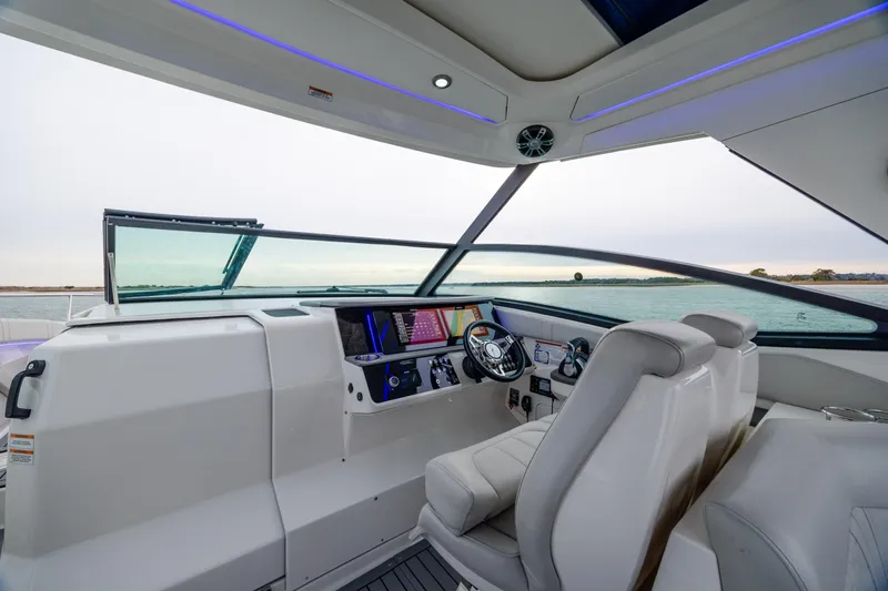  Yacht Photos Pics 2020 Sea Ray Sundancer 320 Outboard helm with modern controls and panoramic water view.