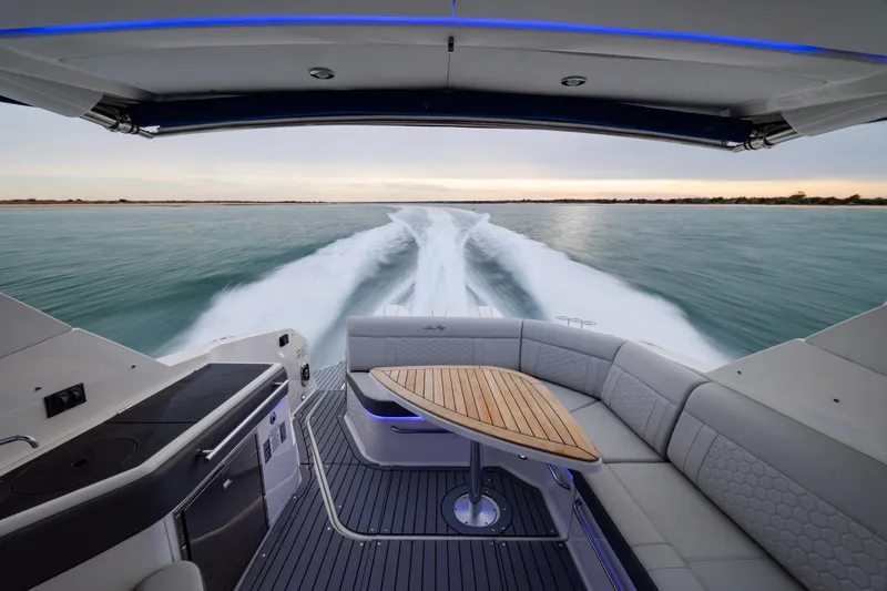  Yacht Photos Pics 2020 Sea Ray Sundancer 320 Outboard cruising on open water, featuring luxurious seating and sleek design.