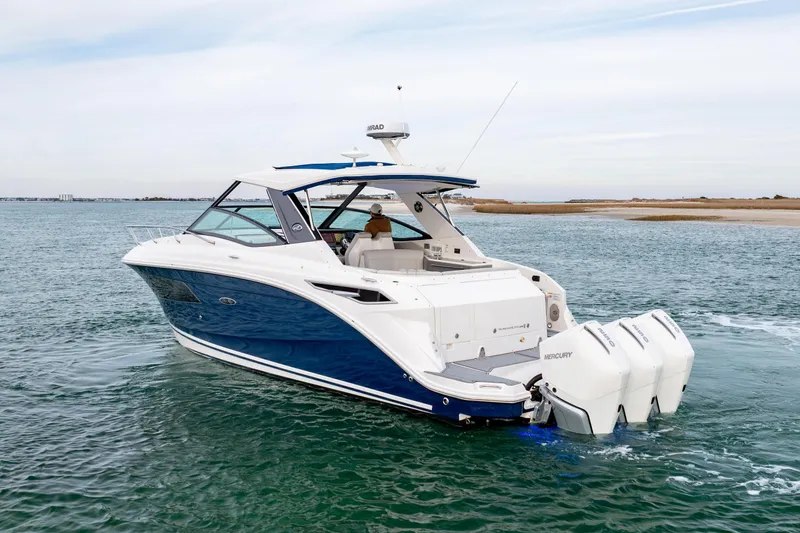  Yacht Photos Pics 2020 Sea Ray Sundancer 320 Outboard cruising on open water, showcasing sleek design and powerful engines.