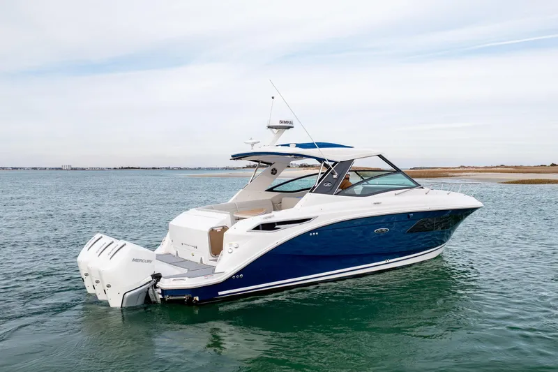  Yacht Photos Pics 2020 Sea Ray Sundancer 320 Outboard cruising on open water, showcasing sleek design.