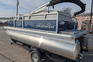2026 Sun Tracker Bass Buggy 16 XL Select pontoon boat on trailer.