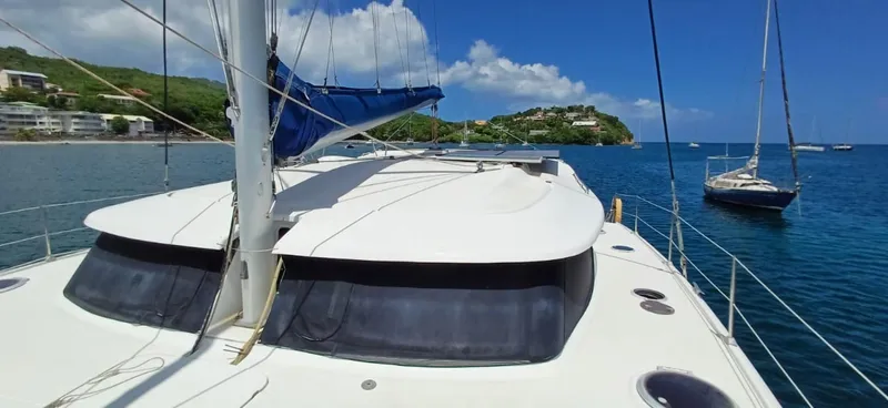  Yacht Photos Pics 2008 Fountaine Pajot Orana 44 Grand Large catamaran docked in scenic coastal waters.