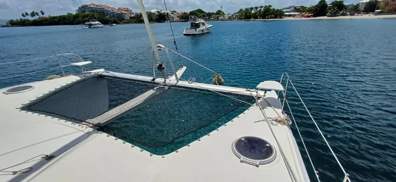  Yacht Photos Pics 2008 Fountaine Pajot Orana 44 Grand Large catamaran on serene blue waters.