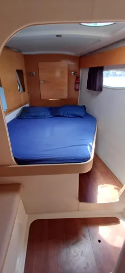  Yacht Photos Pics Cabin interior of 2008 Fountaine Pajot Orana 44 Grand Large with blue bedding.