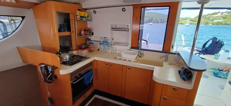  Yacht Photos Pics Interior of 2008 Fountaine Pajot Orana 44 Grand Large catamaran kitchen with ocean view.
