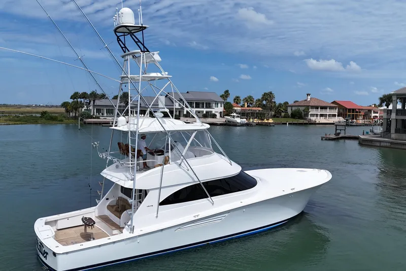 Wildcatter Yacht Photos Pics 2017 Viking 55 Convertible yacht docked in a scenic marina setting.