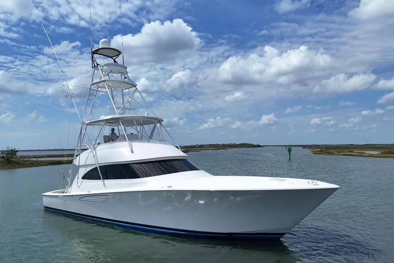 Wildcatter Yacht Photos Pics 2017 Viking 55 Convertible yacht cruising on a sunny day with blue skies.