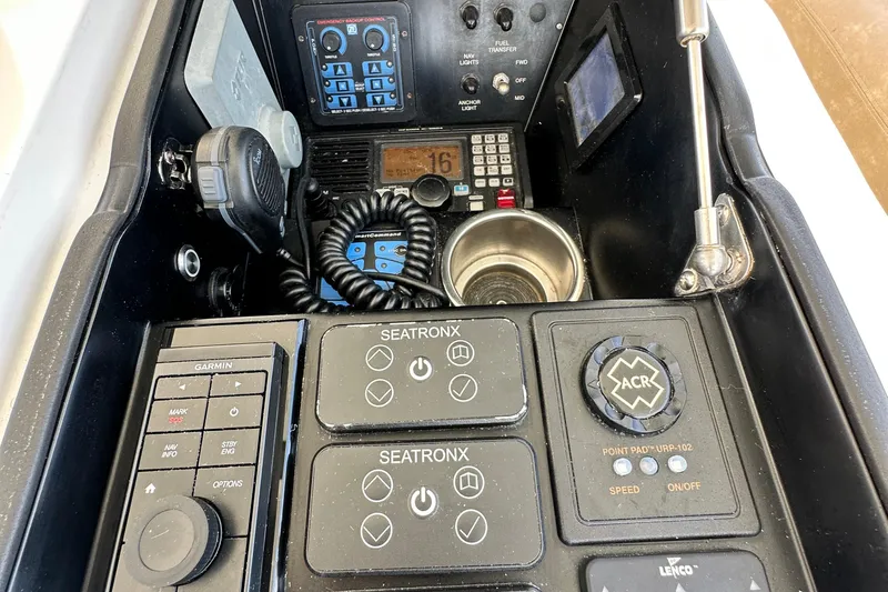 Wildcatter Yacht Photos Pics Control panel of a 2017 Viking 55 Convertible yacht with various navigation instruments.