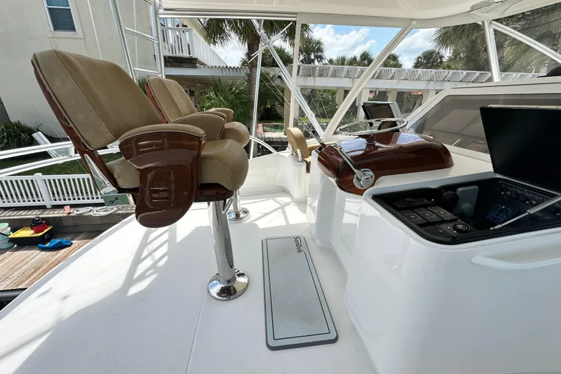 Wildcatter Yacht Photos Pics Luxurious helm of 2017 Viking 55 Convertible yacht with leather seats and modern controls.