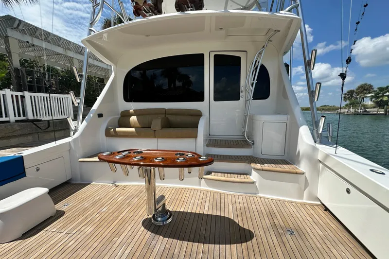 Wildcatter Yacht Photos Pics 2017 Viking 55 Convertible yacht deck with seating and fishing rod holders.