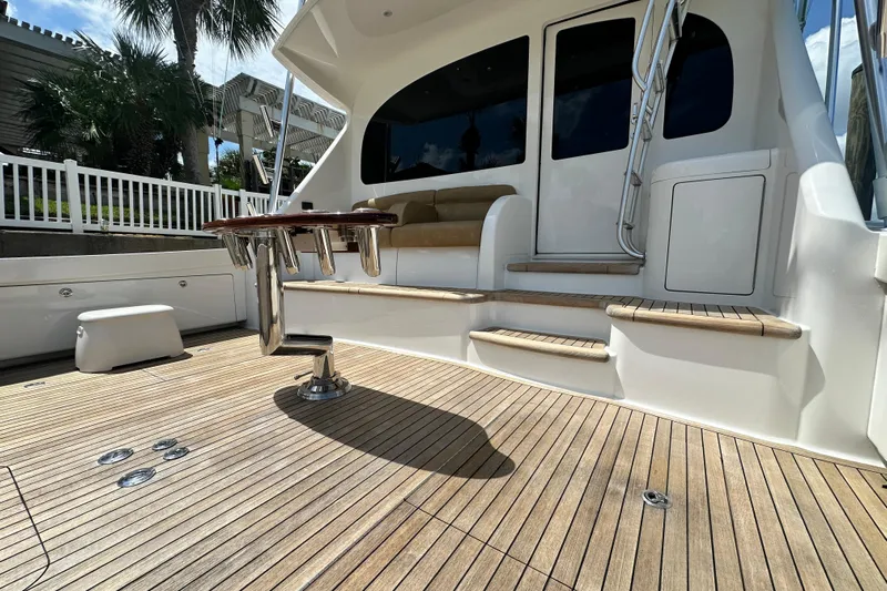 Wildcatter Yacht Photos Pics 2017 Viking 55 Convertible yacht deck with seating and ladder, featuring teak flooring.