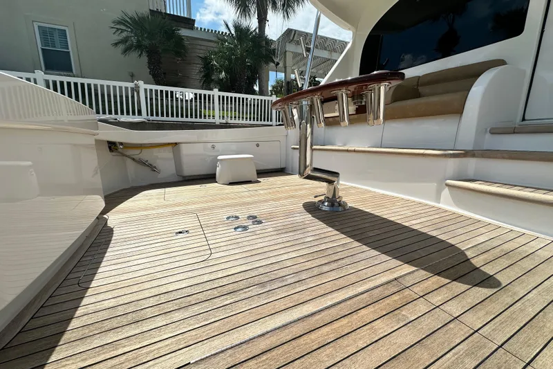 Wildcatter Yacht Photos Pics 2017 Viking 55 Convertible yacht deck with teak flooring and seating area.