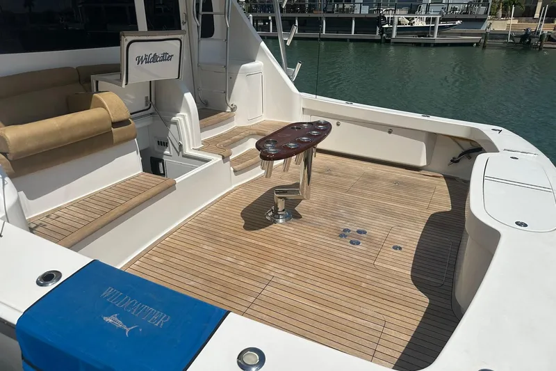 Wildcatter Yacht Photos Pics 2017 Viking 55 Convertible yacht deck with seating and fishing rod holders.