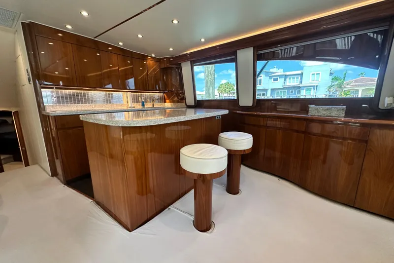 Wildcatter Yacht Photos Pics Luxurious interior of 2017 Viking 55 Convertible yacht with polished wood and modern design.