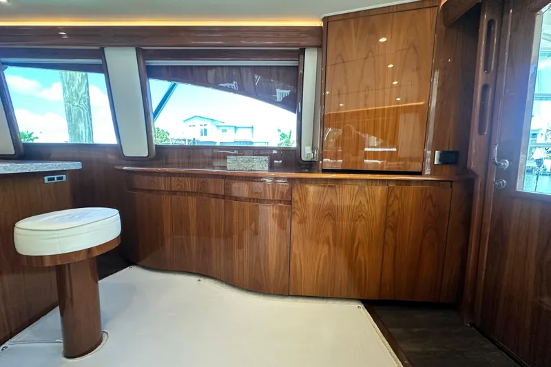 Wildcatter Yacht Photos Pics Luxurious interior of 2017 Viking 55 Convertible yacht with polished wood cabinetry.