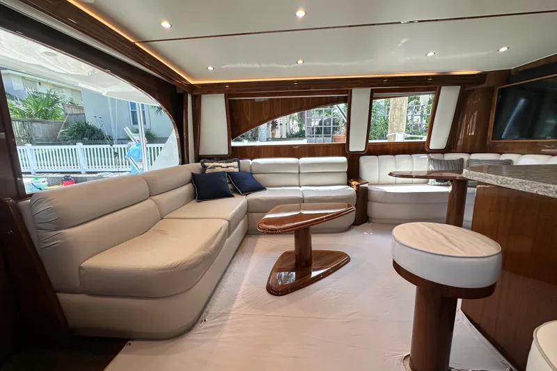 Wildcatter Yacht Photos Pics Luxurious interior of 2017 Viking 55 Convertible yacht with elegant seating and wooden accents.