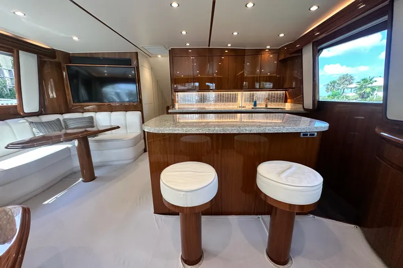 Wildcatter Yacht Photos Pics Luxurious interior of 2017 Viking 55 Convertible yacht with modern kitchen and seating area.