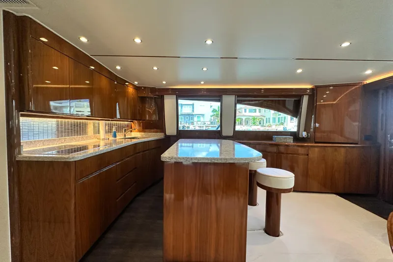 Wildcatter Yacht Photos Pics Luxurious interior of 2017 Viking 55 Convertible yacht with elegant wood finishes.