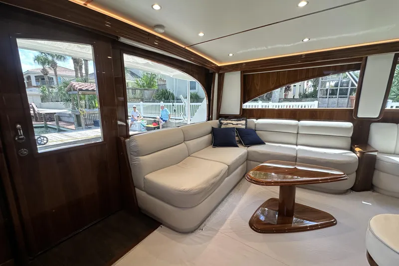 Wildcatter Yacht Photos Pics Luxurious interior of 2017 Viking 55 Convertible yacht with plush seating and elegant wood finishes.