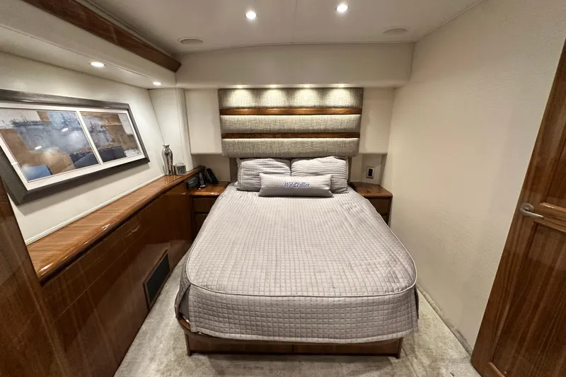 Wildcatter Yacht Photos Pics Luxurious bedroom interior of 2017 Viking 55 Convertible yacht with elegant decor.