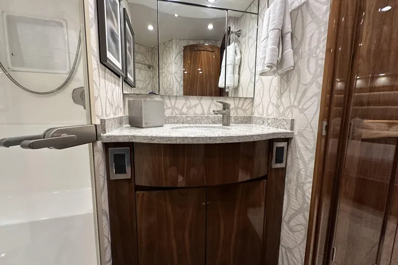Wildcatter Yacht Photos Pics Luxurious bathroom in 2017 Viking 55 Convertible yacht with modern fixtures and elegant design.
