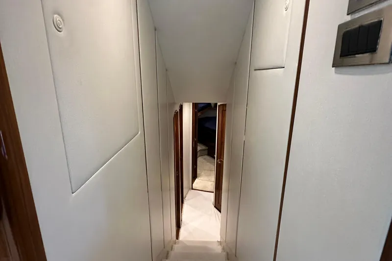 Wildcatter Yacht Photos Pics Interior hallway of 2017 Viking 55 Convertible yacht, featuring sleek design and modern finishes.