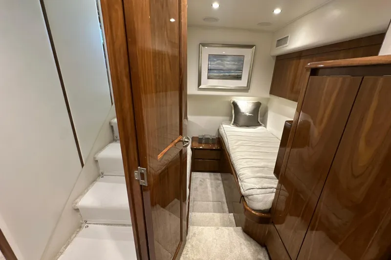 Wildcatter Yacht Photos Pics Luxurious cabin interior of 2017 Viking 55 Convertible yacht with wooden finishes.