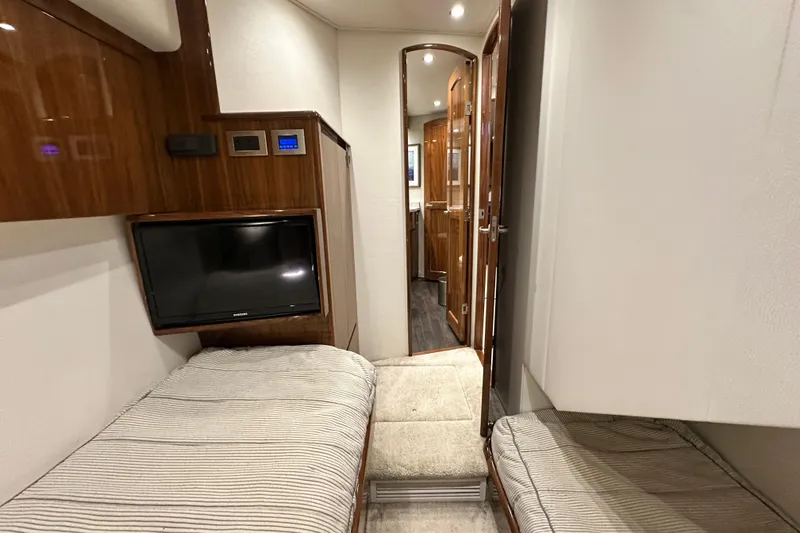 Wildcatter Yacht Photos Pics Interior of 2017 Viking 55 Convertible yacht with twin beds and TV.