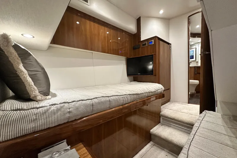 Wildcatter Yacht Photos Pics Luxurious interior of 2017 Viking 55 Convertible yacht with cozy bedding and modern amenities.