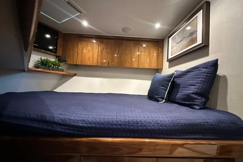 Wildcatter Yacht Photos Pics Luxurious cabin interior of 2017 Viking 55 Convertible yacht with cozy bedding.