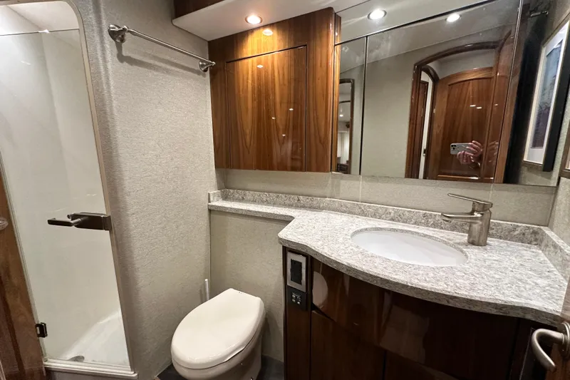 Wildcatter Yacht Photos Pics Luxurious bathroom in 2017 Viking 55 Convertible yacht with modern fixtures and elegant design.