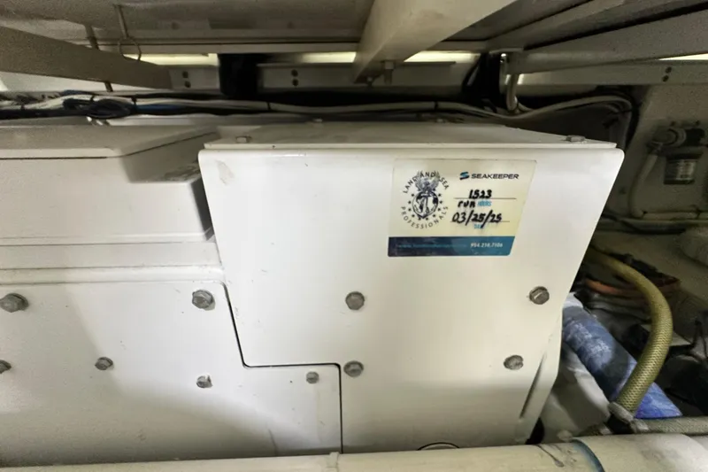 Wildcatter Yacht Photos Pics Engine room of 2017 Viking 55 Convertible with Seakeeper stabilizer unit.