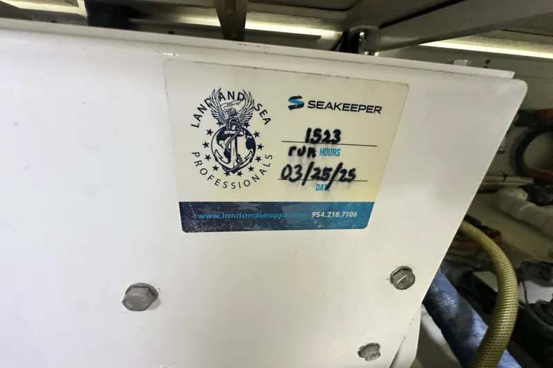 Wildcatter Yacht Photos Pics Sticker on equipment showing "Land and Sea Professionals" and "Seakeeper" with run hours and date.