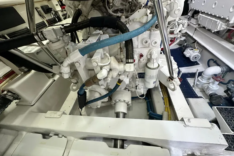 Wildcatter Yacht Photos Pics Engine room of 2017 Viking 55 Convertible yacht, showcasing mechanical components and piping.