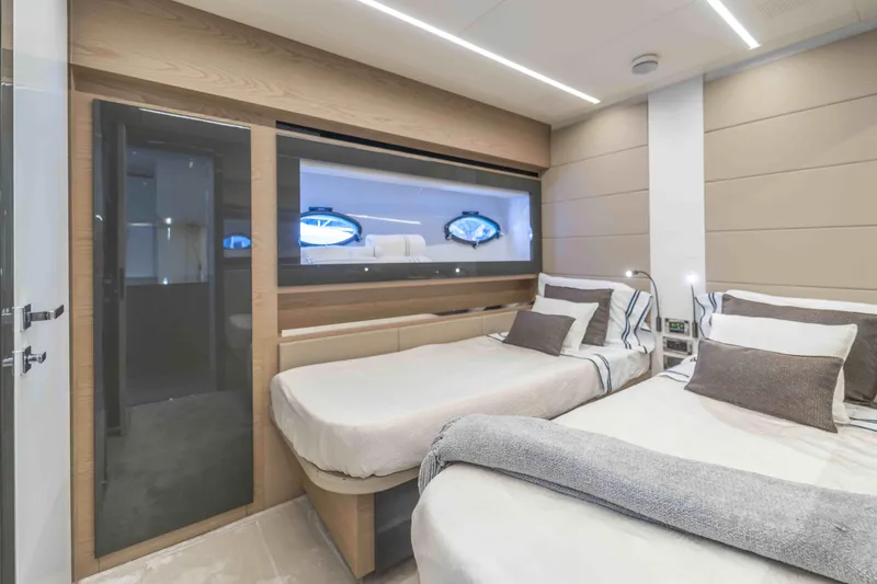 M Yacht Photos Pics Luxurious 2018 Pershing 70 yacht bedroom with twin beds and modern decor.