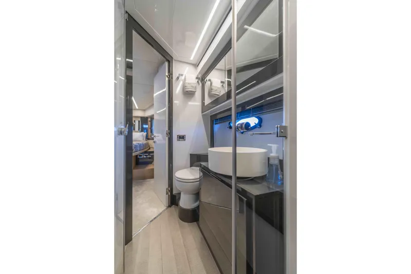 M Yacht Photos Pics Luxurious bathroom interior on a 2018 Pershing 70 yacht, featuring modern fixtures.