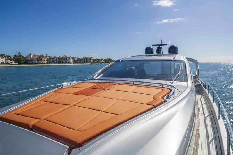 M Yacht Photos Pics 2018 Pershing 70 yacht cruising on a sunny day near coastal residences.