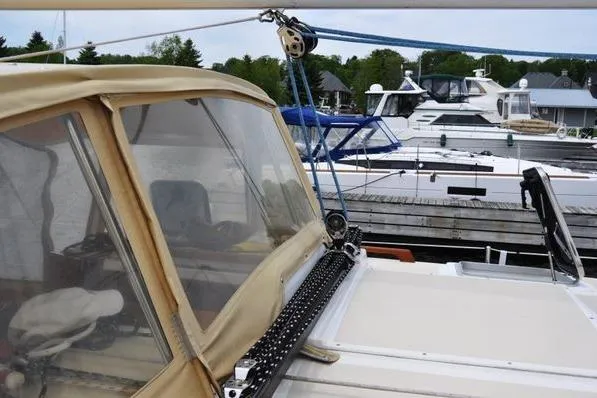 Dragonfly 1 Yacht Photos Pics Sailboat Tartan 4400 (2005) docked at marina with other boats in background.