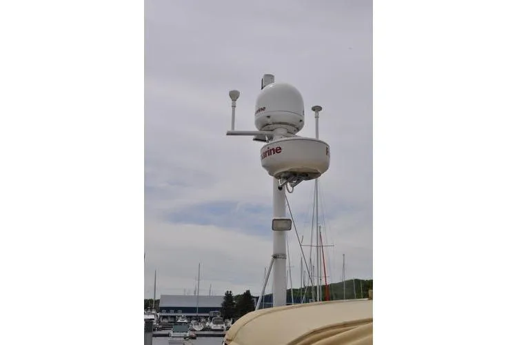 Dragonfly 1 Yacht Photos Pics Radar and communication equipment on a 2005 Tartan 4400 sailboat in a marina.