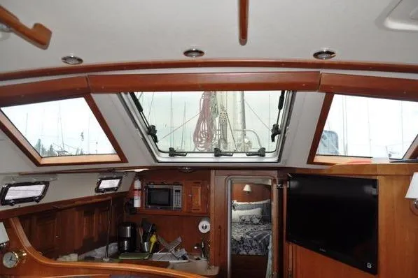Dragonfly 1 Yacht Photos Pics Interior of 2005 Tartan 4400 sailboat with wood finish and skylight.