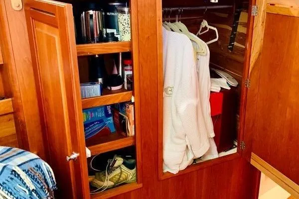 Dragonfly 1 Yacht Photos Pics Wooden closet in 2005 Tartan 4400 yacht, with clothes and shelves for storage.