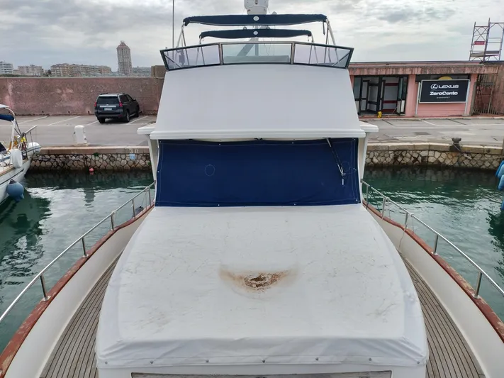 Sesaccia Yacht Photos Pics 2007 Grand Banks 47 Europa yacht docked at marina, front view.