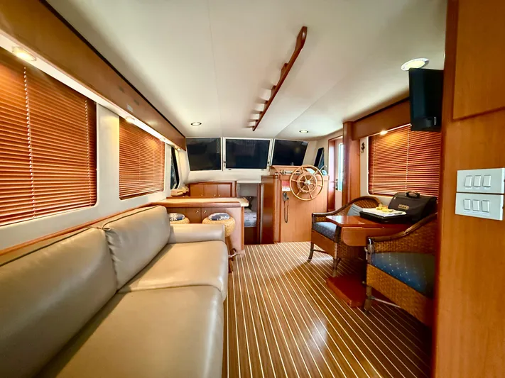  Yacht Photos Pics Interior of 2008 Mainship 34 Trawler with wooden accents and comfortable seating.