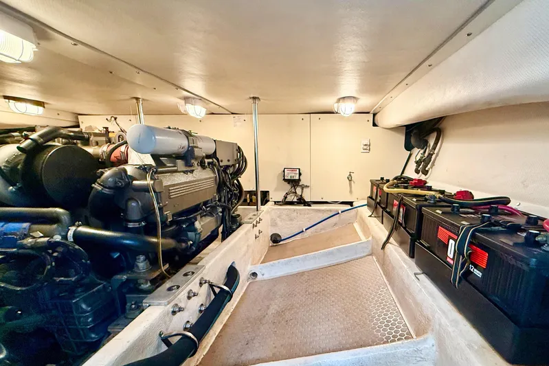  Yacht Photos Pics Engine room of 2008 Mainship 34 Trawler with visible batteries and machinery.