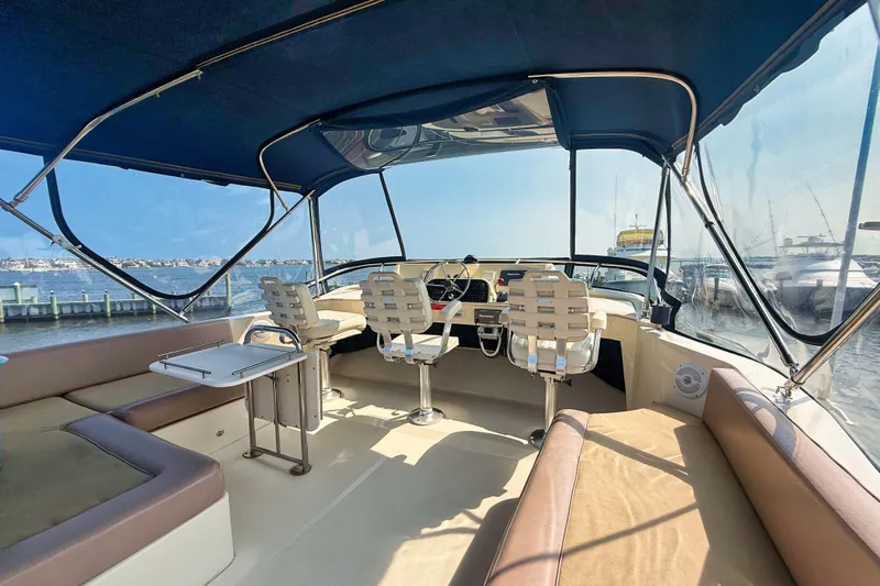  Yacht Photos Pics 2008 Mainship 34 Trawler interior with helm, seating, and waterfront view.