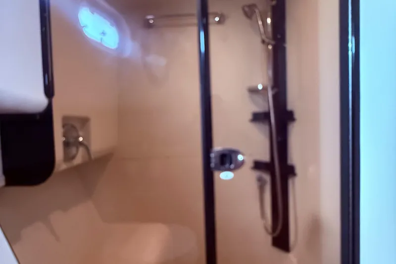  Yacht Photos Pics Bathroom interior of 2008 Mainship 34 Trawler with shower and fixtures.