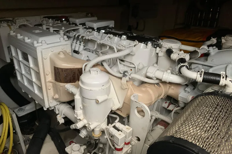  Yacht Photos Pics Engine compartment of a 2008 Mochi Craft 54' Dolphin yacht, showcasing intricate machinery.