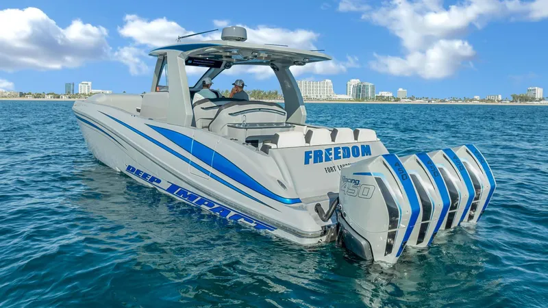  Yacht Photos Pics 2022 Deep Impact 399 Cabin boat on water, featuring four powerful engines.