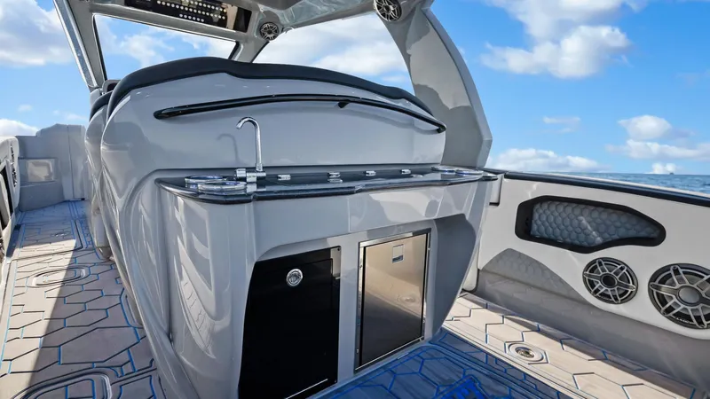  Yacht Photos Pics 2022 Deep Impact 399 Cabin interior with sleek design, featuring a modern kitchenette and ocean view.