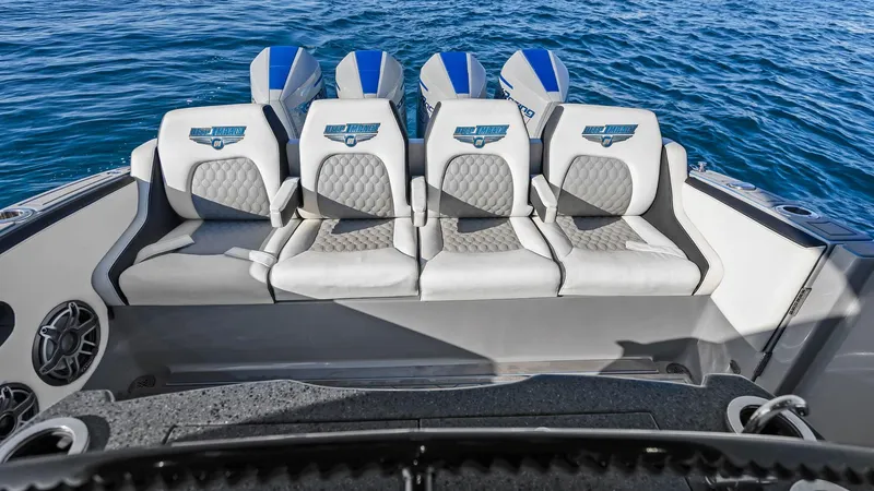  Yacht Photos Pics 2022 Deep Impact 399 Cabin boat with four seats and powerful engines on open water.